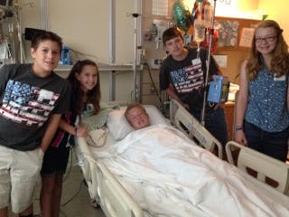 Bailey with his family on his 15th birthday, two days after his SWB accident